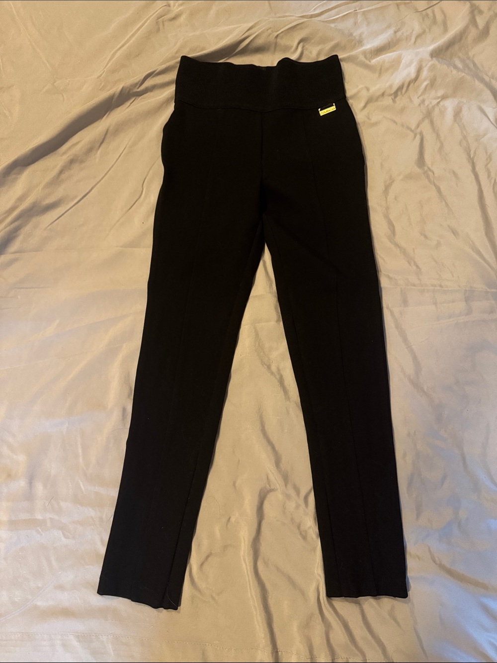 Calvin Klein Black Stretch Pants with Gold Logo Plate